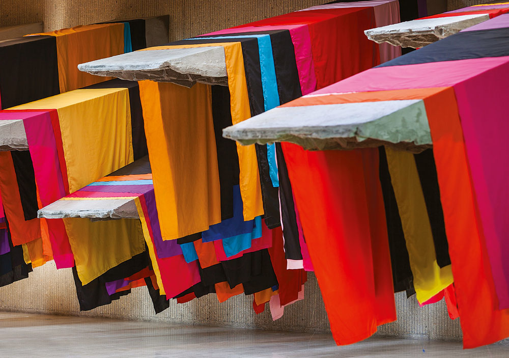 Phyllida Barlow, installation view of untitled: 11 awnings 2013, Des Moines Arts Center, Des Moines, IA, steel armature, polyurethane board, polyurethane foam, cement, scrim, fabric, 155 x 660 x 334 inches. Copyright Phyllida Barlow. Photo by Paul Crosby.