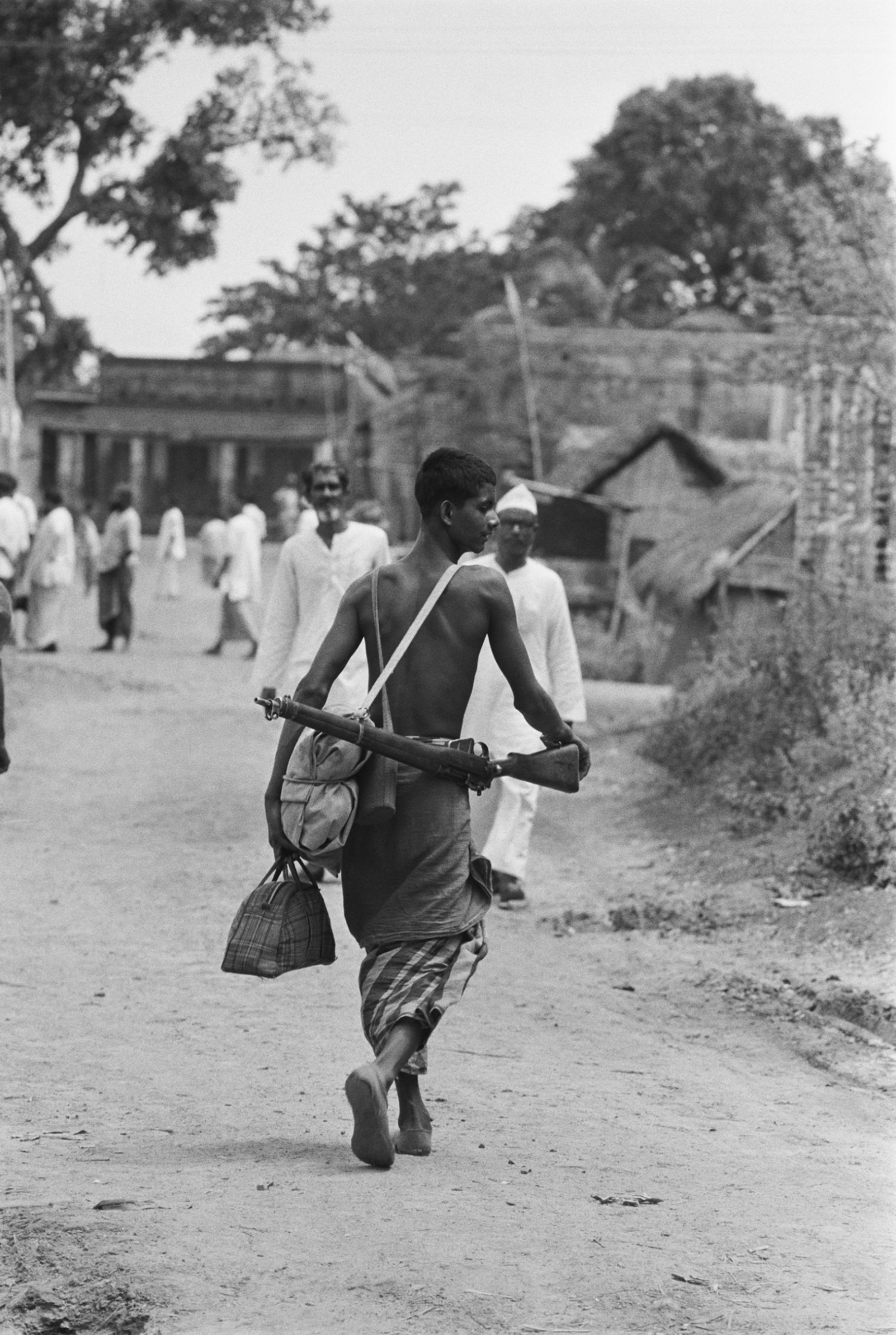 PRESS-A-Mukti-Bahini-fighter-with-a-303-Lee-Enfield-rifle-slung-over ...